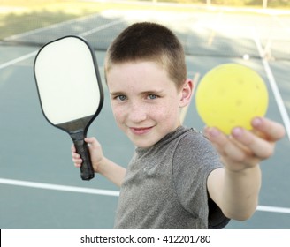 Boy Playing Pickleball