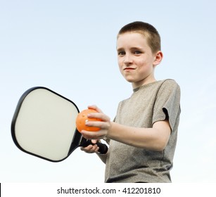 Boy Playing Pickleball