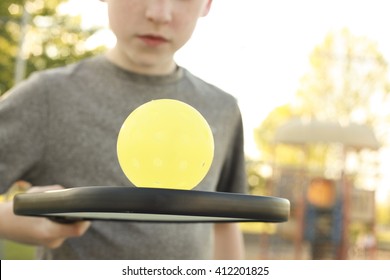 Boy Playing Pickleball