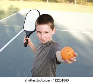 Boy Playing Pickleball