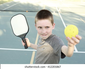 Boy Playing Pickleball