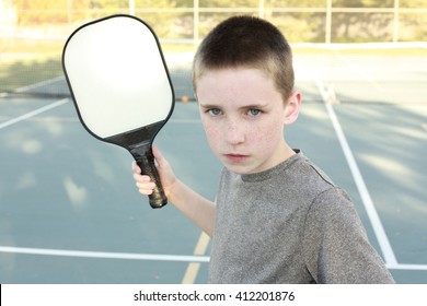 Boy Playing Pickleball