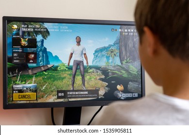 Boy playing PUBG Lite video game on PC at home. PUBG Lite is popular online video game. Vilnius, Lithuania - 19 October 2019