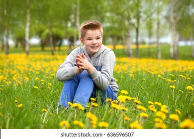 Boy playing with a puppy in the field