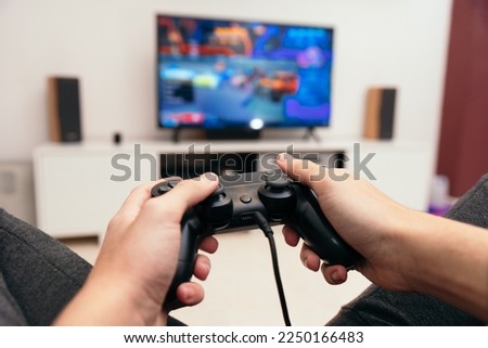 Boy playing video games at home