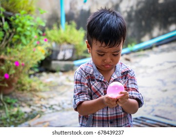 Boy Playing Water Balloon.