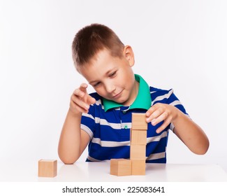 boy plays with cubes