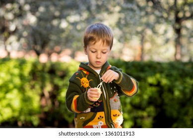 The boy plays in the yard - Shutterstock ID 1361011913