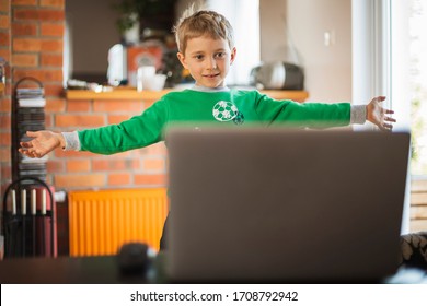The Boy Practices At Home In Front Of The Computer As Part Of An Online Physical Education Lesson Due To Closed Schools Becouse Of Pandemic Coronavirus Covid-19