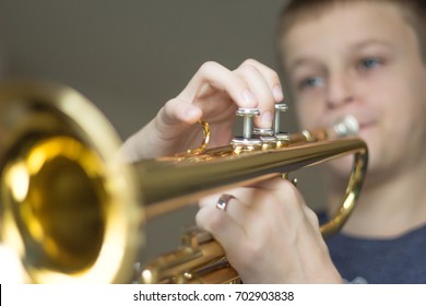 kid playing trumpet