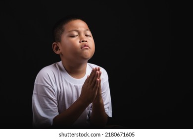 Boy praying to God at home, World Day of Prayer, international day of prayer, hope, gratitude, thankful, trust - Powered by Shutterstock