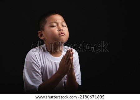Boy praying to God at home, World Day of Prayer, international day of prayer, hope, gratitude, thankful, trust