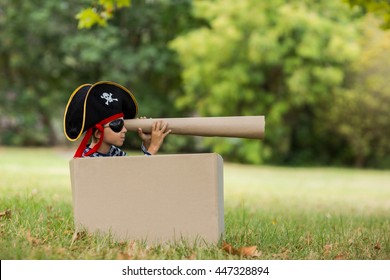 Boy pretending to be a pirate in park - Powered by Shutterstock