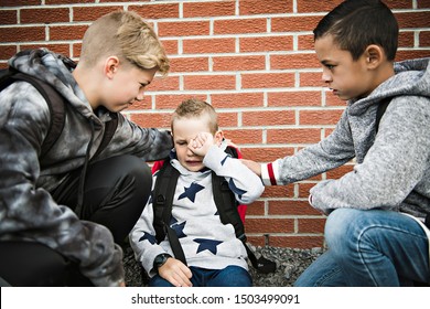 boy problem at school, sitting and consoling child each other
