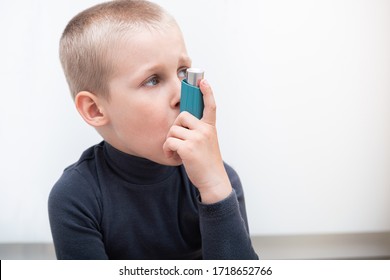 Boy With A Pulmonary Disease School Uses An Asthma Inhaler To Treat The Diagnosis And Symptoms Of Cough. Asthma World Day.