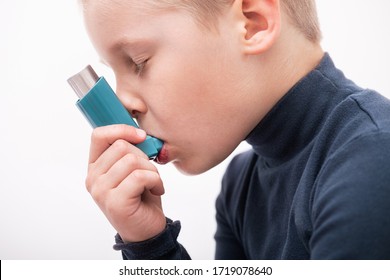 Boy With A Pulmonary Disease School Uses An Asthma Inhaler To Treat The Diagnosis And Symptoms Of Cough. Asthma World Day.
