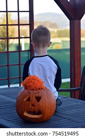 Boy with pumpkin
