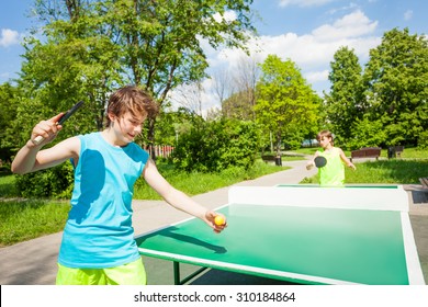 Boy with racket ready to play in table tennis