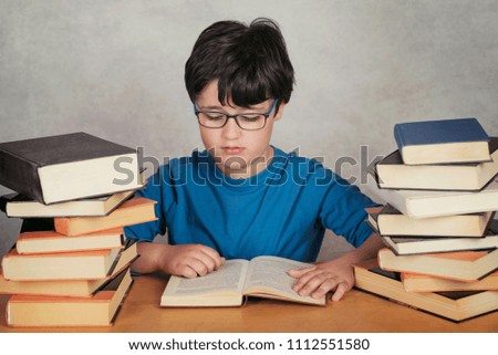 Similar – boy reading books