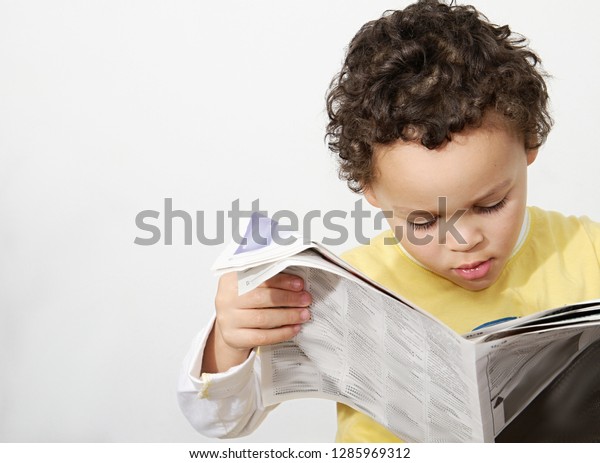 Boy Reading Newspaper Looking Paper Been Stock Photo Edit Now