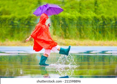 A Boy With A Red Raincoat Are Joyfully.