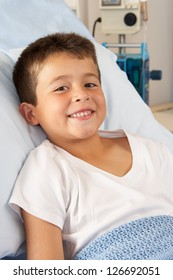 Boy Relaxing In Hospital Bed