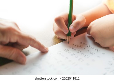 A Boy Reviews His Homework With His Grandmother. Addition, Calculation Error, 1st Grade, Arithmetic, Check