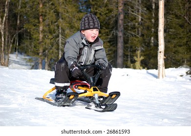 
Boy Riding On A Toboggan