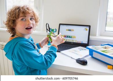 Boy In Robotics School Makes Robot, Managed From The Constructor, Boy Programming Robot,  Pupils In Science Lesson Studying Robotics, Education, Science And People Concept, Children, Technology