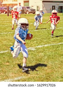 Boy running during an American Football game