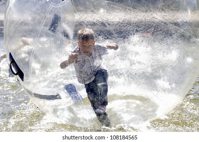 Boy Is Running Inside Plastic Bubble