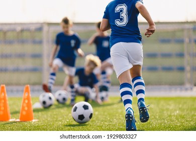 Boy Running on Grass Field in Soccer Cleats. Closeup image on Football Shoes.  Young Boy in Turf Boots for Playing Football on Natural and Artificial Ground - Powered by Shutterstock