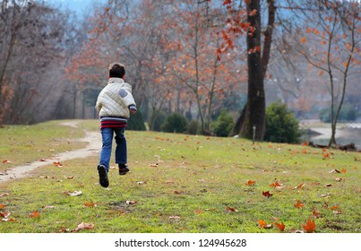 Boy Is Running In The Park