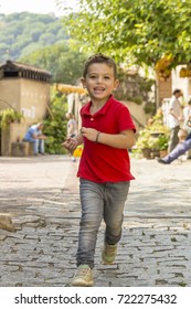 Boy Running Towards The Camera Outside