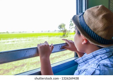 The Boy Sat On The Train To Travel.