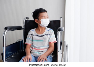 The Boy Sat In A Sad, Dejected Wheelchair, Looking Out The Window.