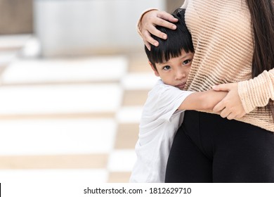 The Boy Was Scared And Hugged His Mother. Asian Little Child Is Sad And Fear. Domestic Family Violence Concept.