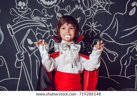 Boy in scary Hallowe'en costumes . Dracula.