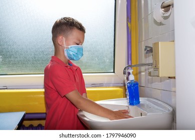 Boy at school washes his hands - Powered by Shutterstock