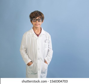 Boy Scientist Researcher Lab Worker In White Lab Coat And Glasses Isolated On Blue Background