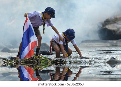 Boy Scout Help Each Other From The River.