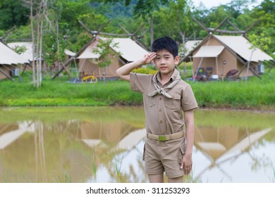 Boy Scout, A Thai Asian Boy Scout In Uniform With Cheerful Smile Stand At Salute