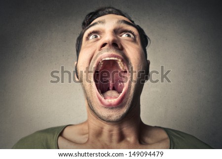 boy screams opening the mouth