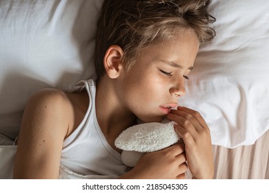 The Boy Sees A Nightmare In Sleep. Restless, Unhealthy Sleep In Children After Watching A Horror Movie, Computer Game.