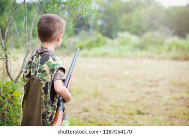 Boy With Shotgun While Dove Hunting