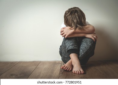 Boy shouts covered his face with his hands. Stressed child. Domestic Family violence and aggression concept violence. concept for bullying, depression stress or frustration. - Shutterstock ID 772801951