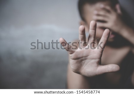 Boy showing hand signaling to stop useful to campaign against violence and pain. Stop abusing boy violence. Human Rights Day concept.