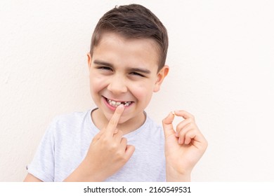 Boy Showing His Lost Milk Tooth, Close Up