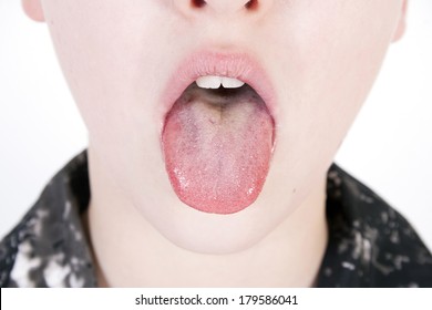Boy Showing The Tongue