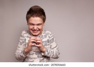 a boy with a sinister mean expression - Shutterstock ID 2078356663